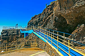 Wheelchair friendly blue ramp on the hotel beach in Madeira Island, Portugal.
