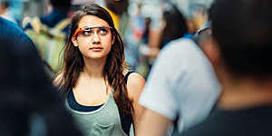Teenage girl wearing Google Glasses, on Times Square.