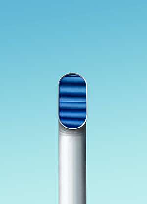 Insdustrial air ventilation of an oval shape, with a blue sky as it's background.